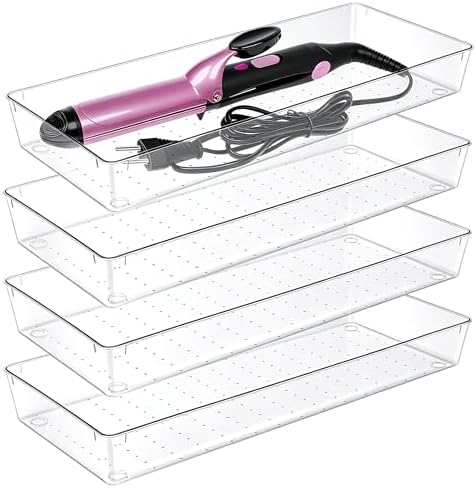 Clear plastic drawer organizer trays in several sizes arranged in a drawer