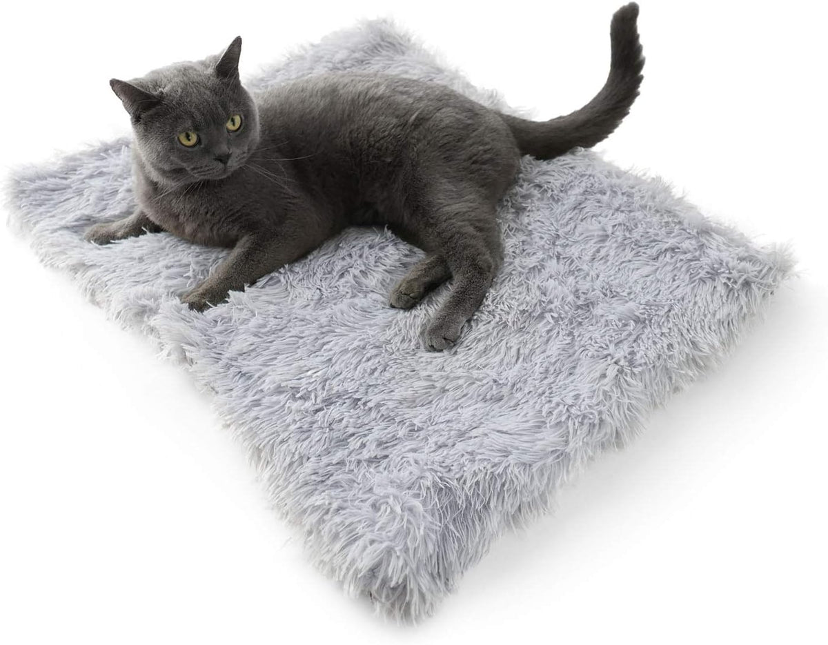 grey furry pet bed used flat as a mat