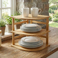 3-tier bamboo corner shelf holding plates and jars in a kitchen corner