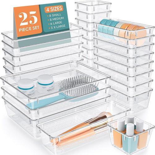 Clear plastic drawer organizer trays in several sizes arranged in a drawer